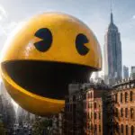 Giant 3D Pac-Man floating between Manhattan buildings