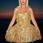 Singer Bárbara Bandeira wearing the one-of-a-kind dress made entirely of traditional Portuguese jewelry by Portugal Jewels